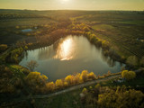 Fototapeta Tęcza - top view small lake with sunset light