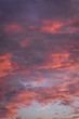 Orange, pink and red clouds during sunset over Warsaw city, Poland