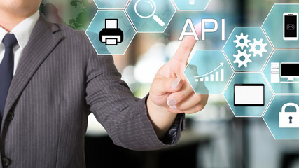 API  Application Programming Interface businessman pointing a visual icon.
