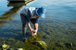 © GenоМ. - Fishing. Fisherman and trophy Pike. Open-mouthed large pike in the angler's hands.