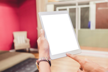 Wall Mural - Mockup tablet on businessman hands empty display on home table with blur background. - Image - Image