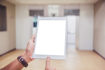 Wall Mural - Mockup tablet on businessman hands empty display on home table with blur background. - Image - Image