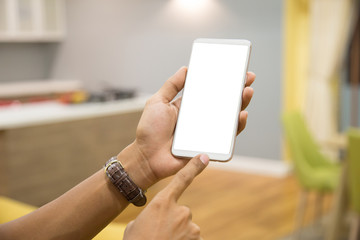 Wall Mural - Mockup smartphone on businessman hands empty display on home table with blur background. - Image - Image