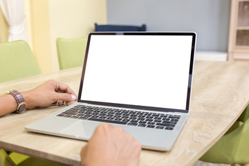 Wall Mural - Mockup image of a businessman using laptop with blank white desktop screen working in home- Image