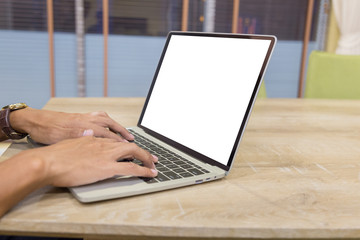 Wall Mural - Mockup image of a businessman using laptop with blank white desktop screen working in home- Image