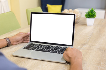 Wall Mural - Mockup image of a businessman using laptop with blank white desktop screen working in home- Image