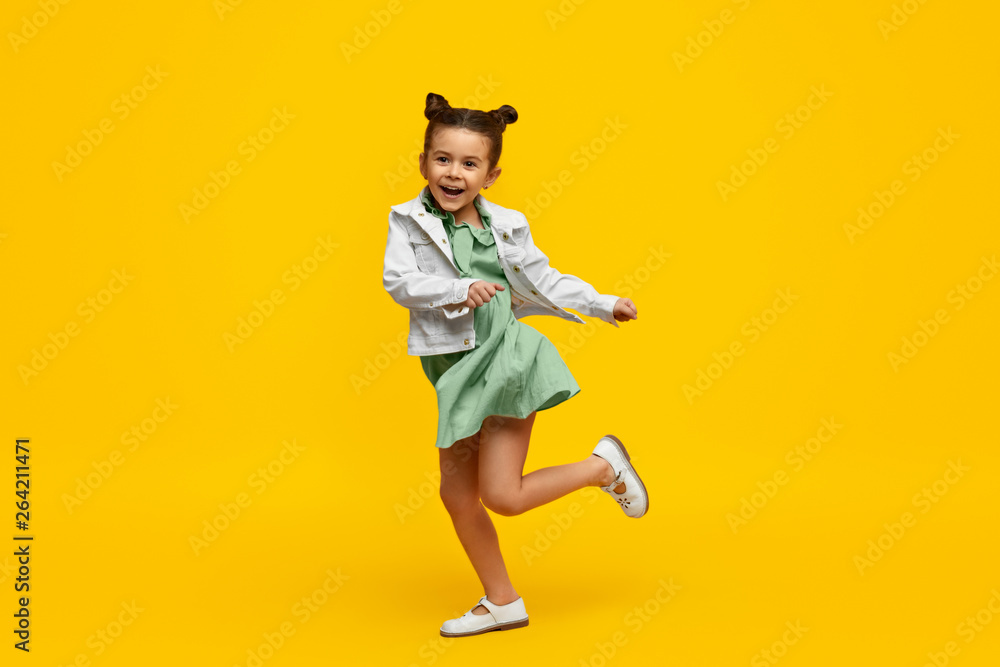 Stylish child smiling and dancing - obrazy, fototapety, plakaty 