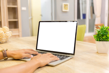 Wall Mural - Mockup image of a businessman using laptop with blank white desktop screen working in home- Image