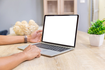 Wall Mural - Mockup image of a businessman using laptop with blank white desktop screen working in home- Image
