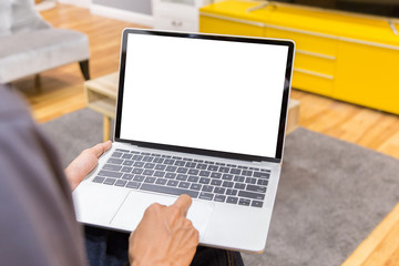 Wall Mural - Mockup image of a businessman using laptop with blank white desktop screen working in home- Image