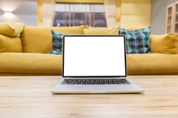 Wall Mural - laptop showing blank screen on work table front view in home- Image