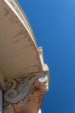 Exterior Architecture Curved Balcony With Carved Corbel, Blue Sky Copy Space, Vertical Aspect