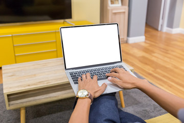 Wall Mural - Mockup image of a businessman using laptop with blank white desktop screen working in home- Image