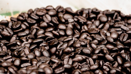 Many roasted black coffee beans. Concept Love with coffee.