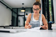 © bnenin - Close-up image of young woman writting.
