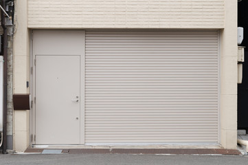 A closeup shot of automatic metal roller door used in factory, storage, garage, and industrial warehouse. The corrugated and foldable metal sheet offer space saving and provide urban and rustic feel