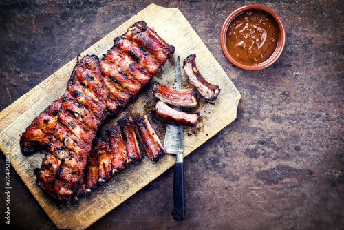Fotomural Barbecue spare ribs St Louis cut with hot honey chili marinade as top view on a