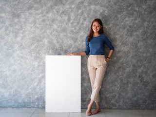 Asian woman with white banner copy space