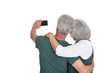 © aletia2011 - Portrait of senior couple taking selfie isolated on white background