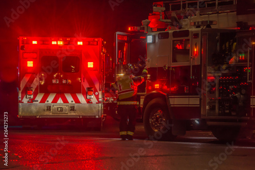 fire truck, firefighter, ambulance responding to car crash at night Tableau sur Toile
