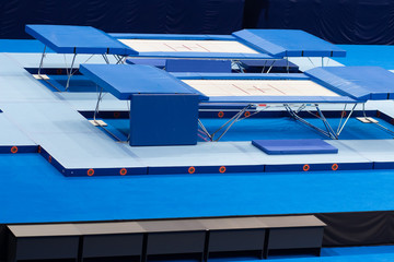 Empty trampolines in sports arena during sport competitions