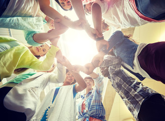 Sticker - education, school, teamwork and people concept - international students making circle of hands