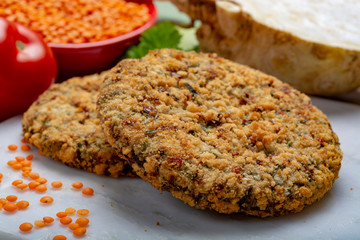 Wall Mural - Tasty vegetarian food, raw burgers made from lentils legumes with vegetables ready for cooking