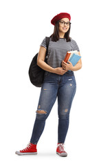 Wall Mural - Female student posing with books in her hands