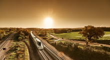 High Speed Train Approaching From Sunrise