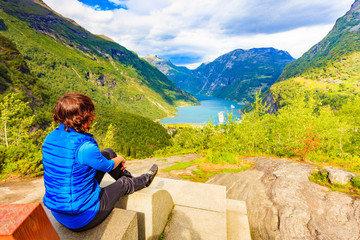 Canvas Print - Tourist enjoying Geirangerfjord from viewing point