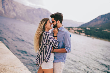 Couple in love, enjoying the summer time by the sea.