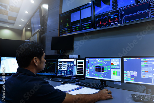 Vászonkép  Engineer looking to work in the electrical control room