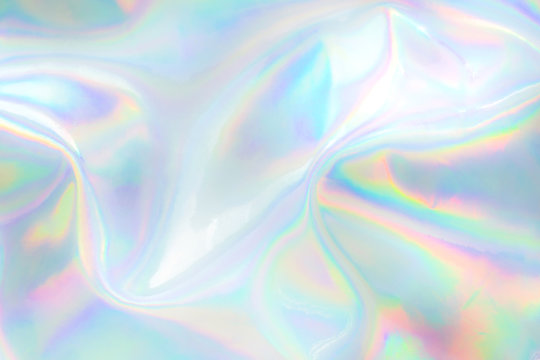 abstract trendy holographic background. real texture in pale violet, pink and mint colors with scrat