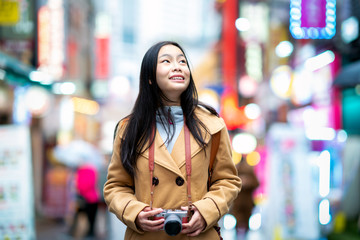 Canvas Print - Young asian woman traveler traveling and shopping in Myeongdong street