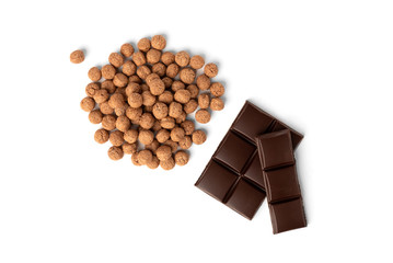 Wall Mural - Chocolate dried balls and chocolate bar isolated on white  background.