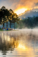 Wall Mural - morning in pang oung with the light and shadow and steam over the lake in meahongson,thailand