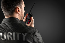 The Man, Security, Is Holding A Walkie-talkie. The Concept Of Protection, Protection Of Information, Bodyguard.