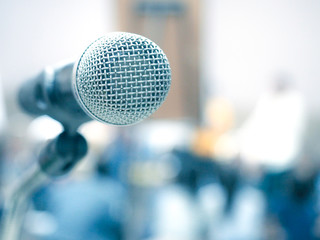 The microphone with  blur seminar room background.