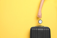 Woman Weighing Suitcase Against Color Background, Closeup. Space For Text