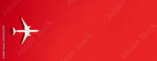 Foto  Travel concept on red background with copy space
