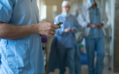 Doctor using mobile in hospital. Medical concept