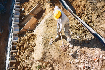 Construction worker on a heavy site doing hard work.