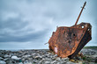 © Jeremy Walton/Scopio - rusty boat tilts on rocks