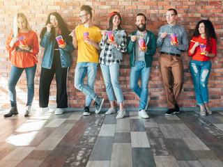 Wall Mural - Diverse business team. Coworking office. Lunch time. Group of millennials with takeout boxes. Food delivery for busy guys