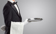 © ra2 studio - Waiter serving with white gloves and steel tray in an empty space