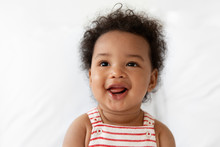 Portrait Of Smiling Baby With Afro Hair