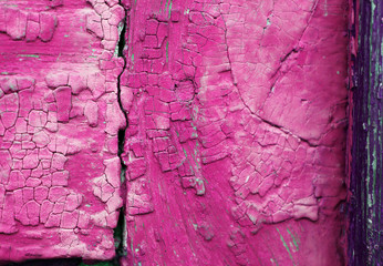 Old wooden background with remains of pieces of scraps of old paint on wood. Texture of an old tree, vintage wood background peeling paint. old blue board with cracked paint