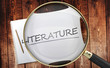 Study, learn and explore literature - pictured as a magnifying glass enlarging word literature, symbolizes analyzing, inspecting and researching the meaning of literature, 3d illustration