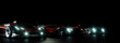 Sportwagen Gruppe mit LED Scheinwerfern bei Nacht