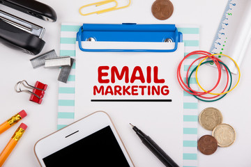 Wall Mural - Email Marketing concept. Office desk with stationery and mobile phone